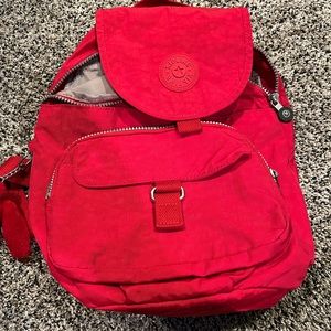 Red mini backpack by Kipling “waterproof” material only used a few times